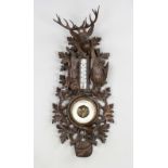 Hunting barometer, early 20th century, openwork carving with hunting trophies. Barometer and