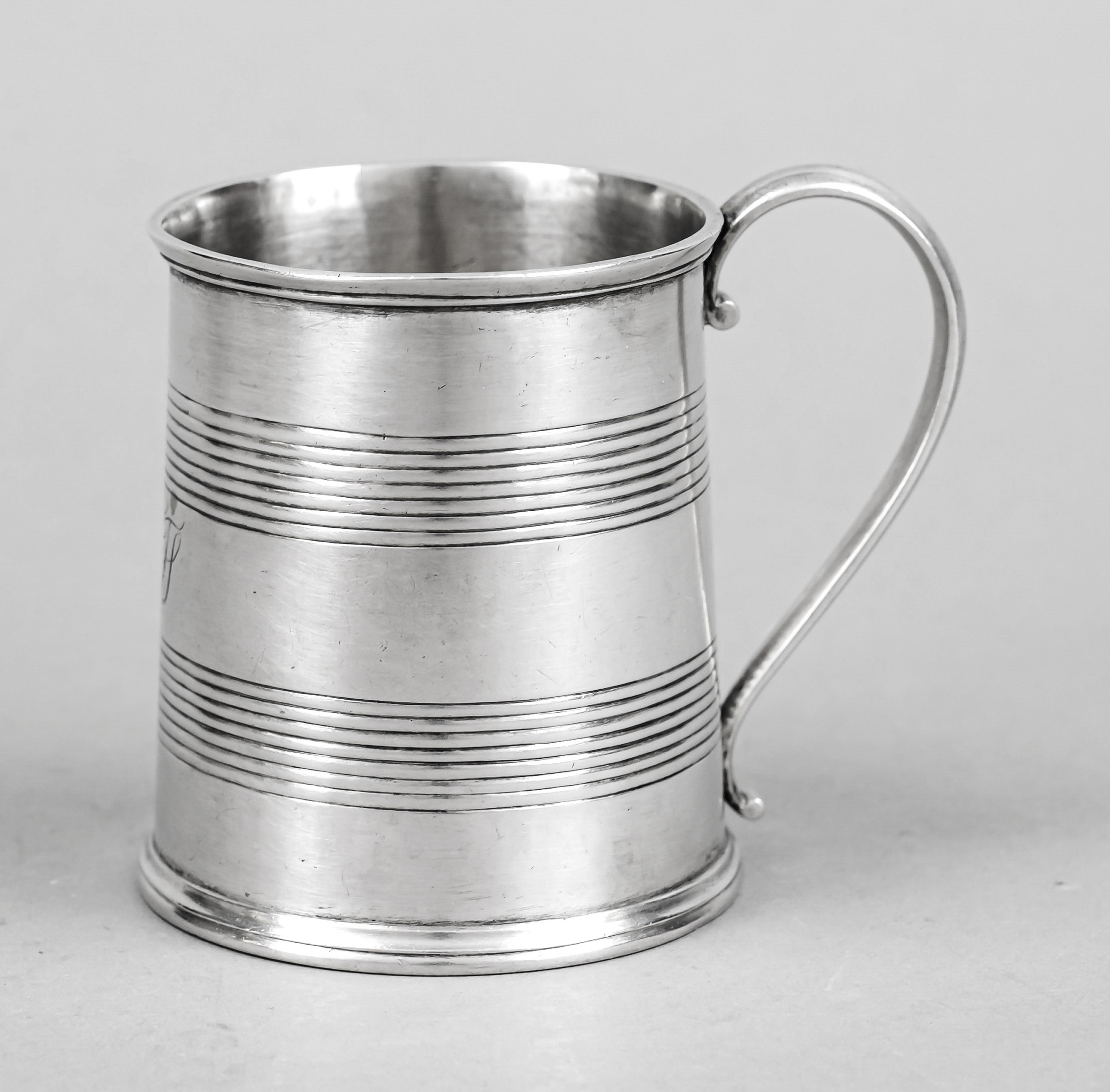 Mug, c. 1900, marked F. Saurier, silver tested, round profiled stand, body with tapering wall, ear
