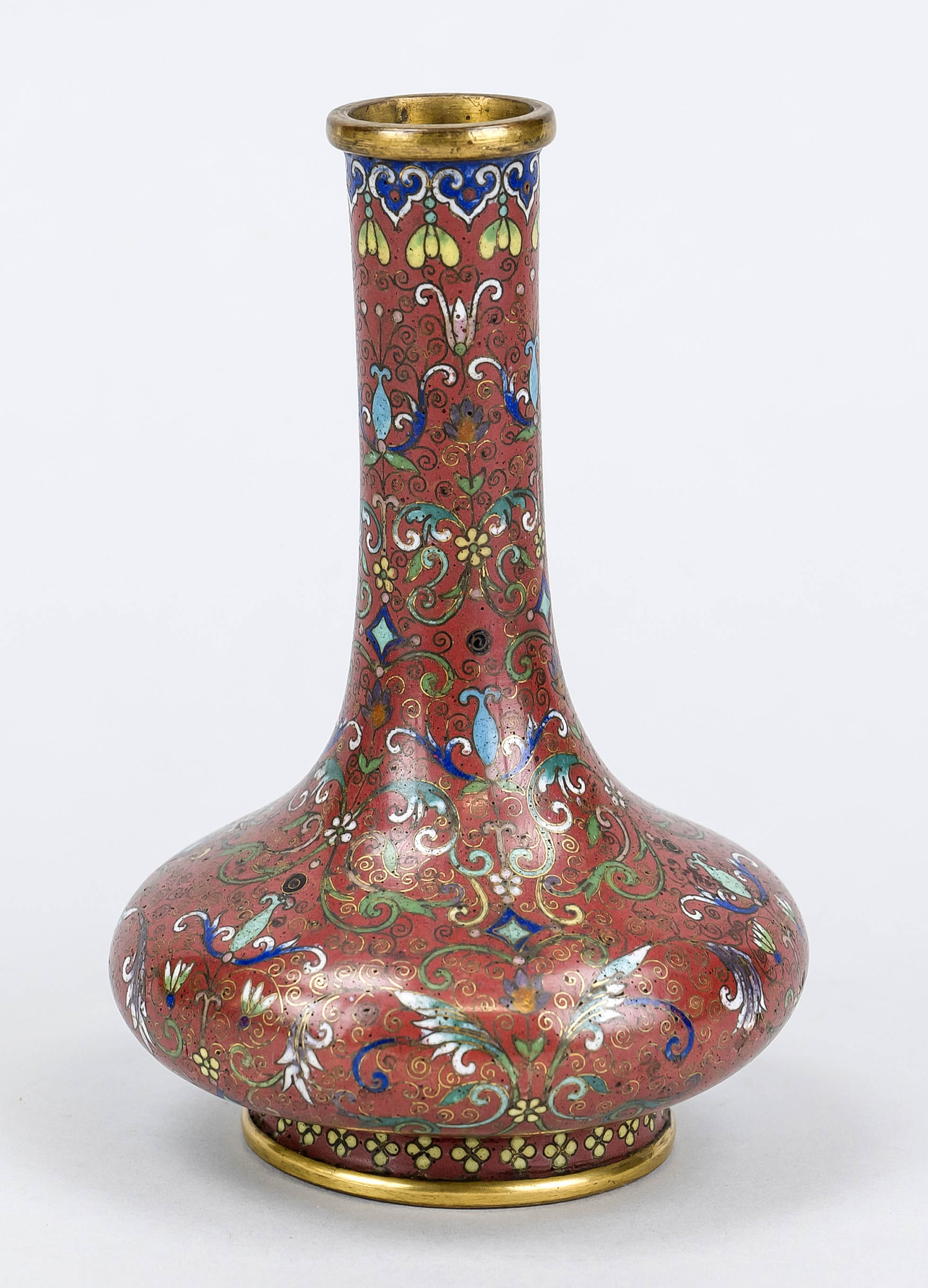 Small cloisonné vase, Japan/China, late 19th century, stylized tendrils and flowers on a dark red
