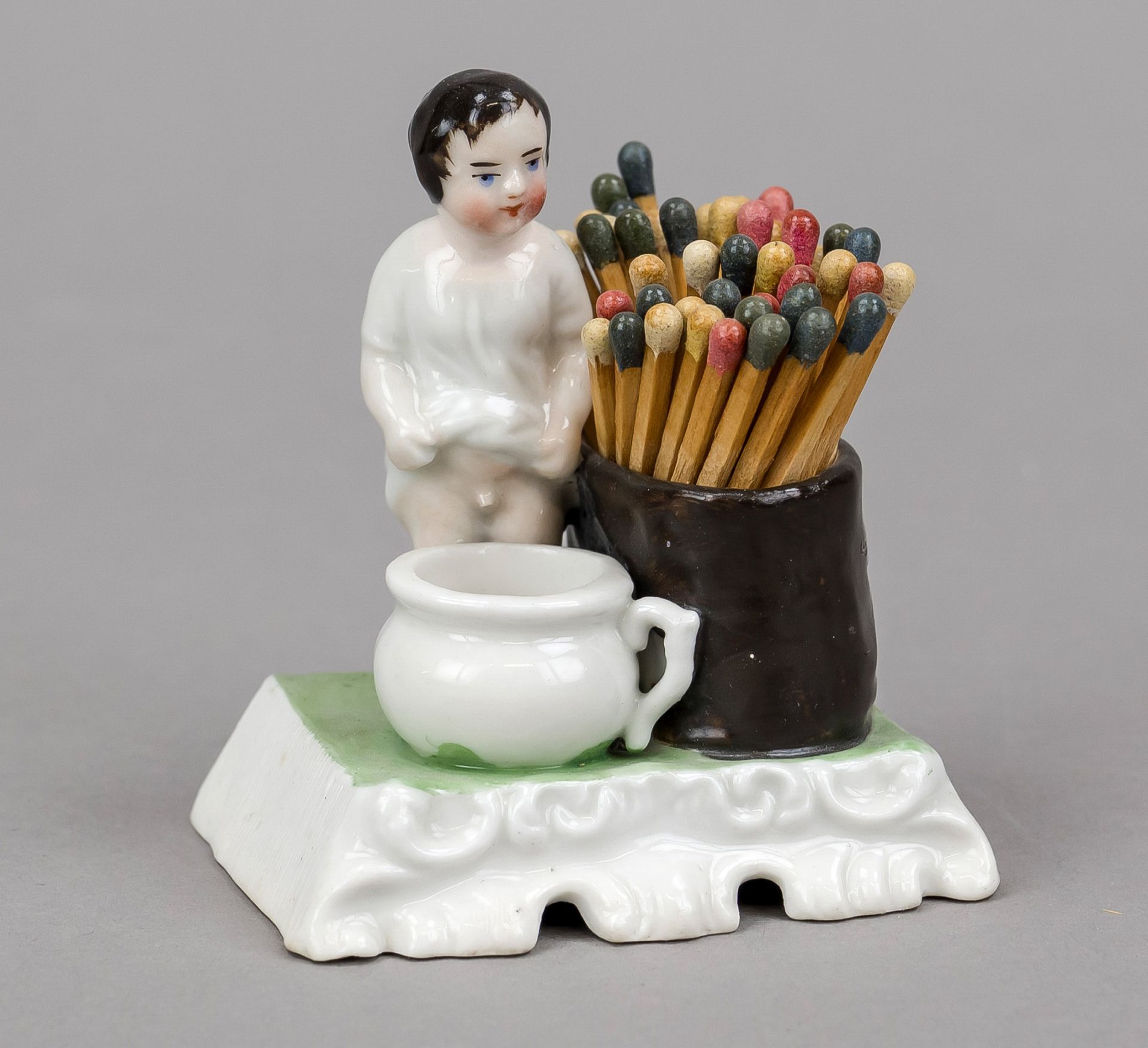 Humorous match holder, late 19th century, polychrome painted and glazed porcelain. Little boy