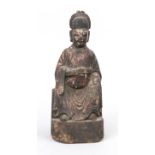 Figure of an official, China, 17th/18th century, wood with remains of an old paint, sooty patina,