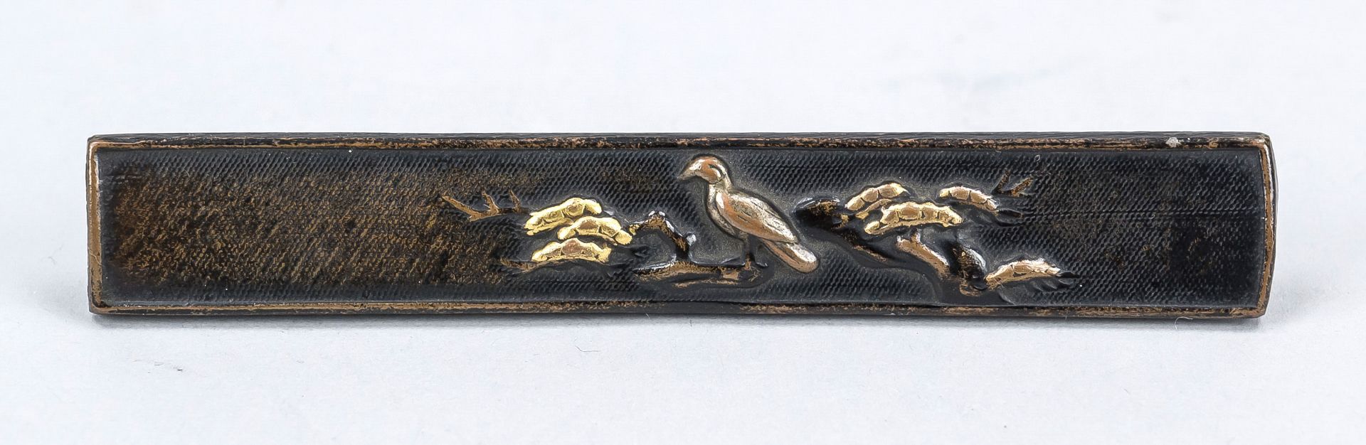 Kozuka, Japan 19th century, Edo-period. Bronze with fine relief decoration and gold inlay. One