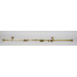 Curtain rail, 20th century, brass. With profiled finials, wall brackets and rings with shell-