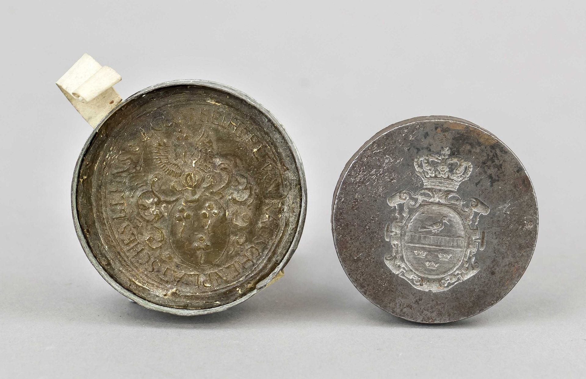 Set of seals, 17th and 19th century. One iron seal plate with an incised coat of arms and a crown