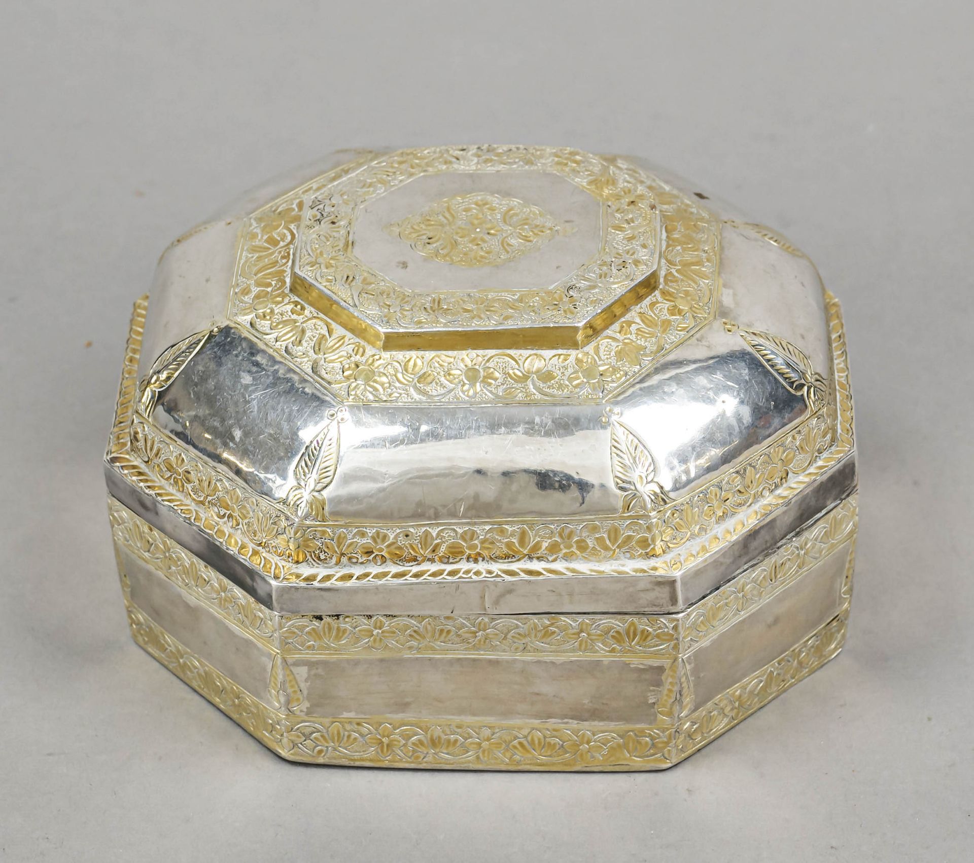 Octagonal lidded box, Persia(?), 20th century, silver tested, with remains of partial gilding,