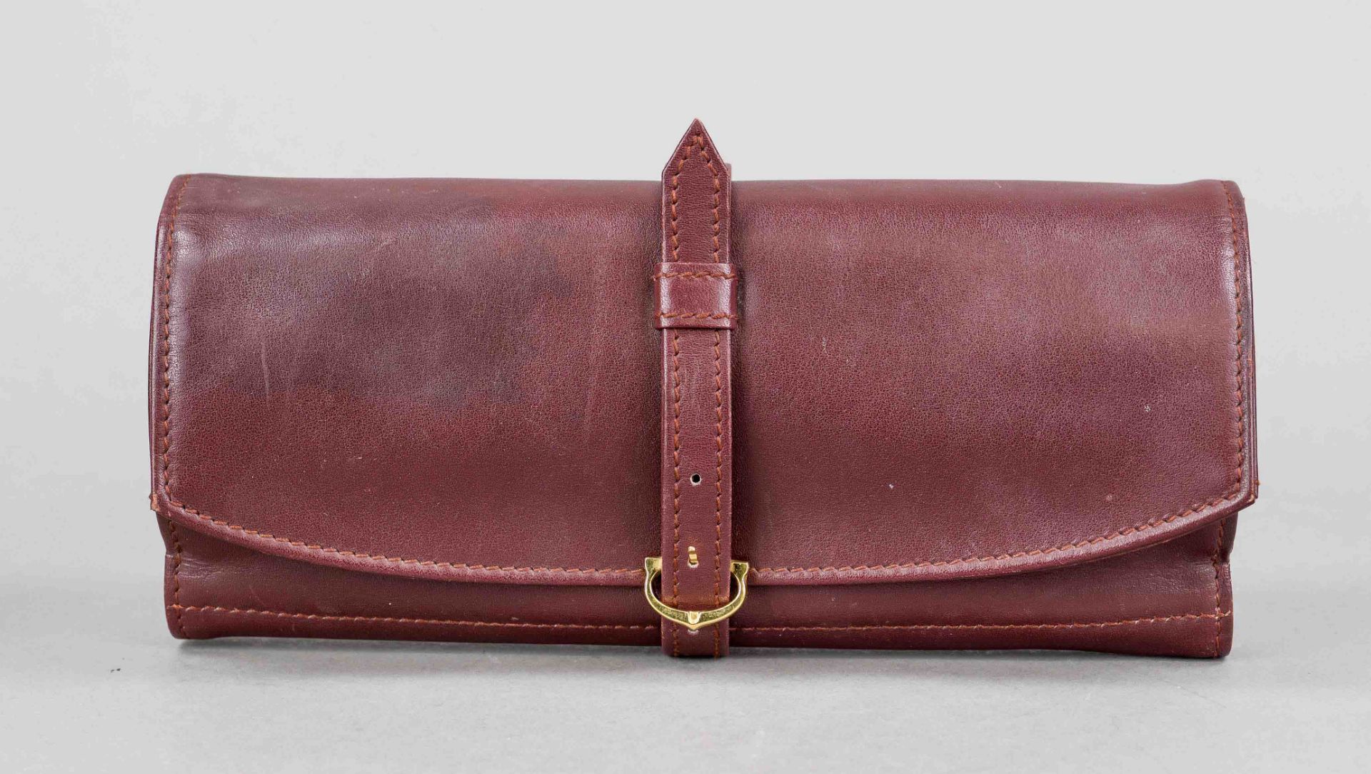 Cartier, leather case (travel case for jewelry?), burgundy smooth leather, gold-coloured hardware,