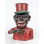 Mechanical money box, probably 19th/20th century, cast iron, colored. By pressing the lever on the