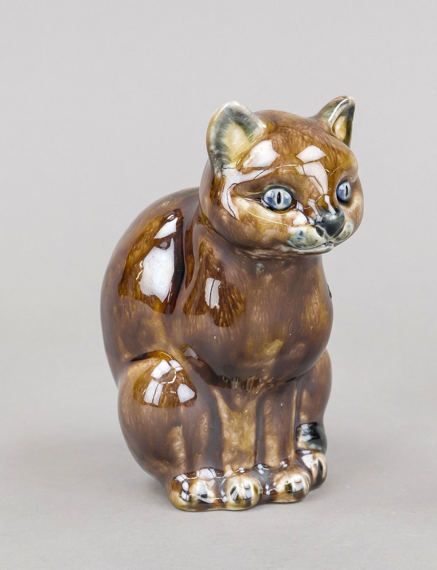 Sitting cat, 20th century, ceramic, signed Lui Bahn, brown luster glaze in tiger look, h. 14 cm