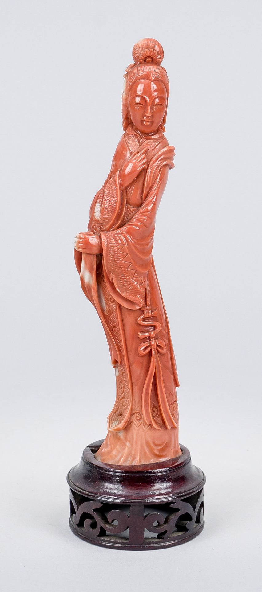 Figural coral carving, China, 19th/20th century Mounted on an openwork base of dark wood, h. 17.5 (