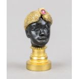 Figural seal, 19th/20th century, bronze/brass, partially gilt. A young man with an oriental