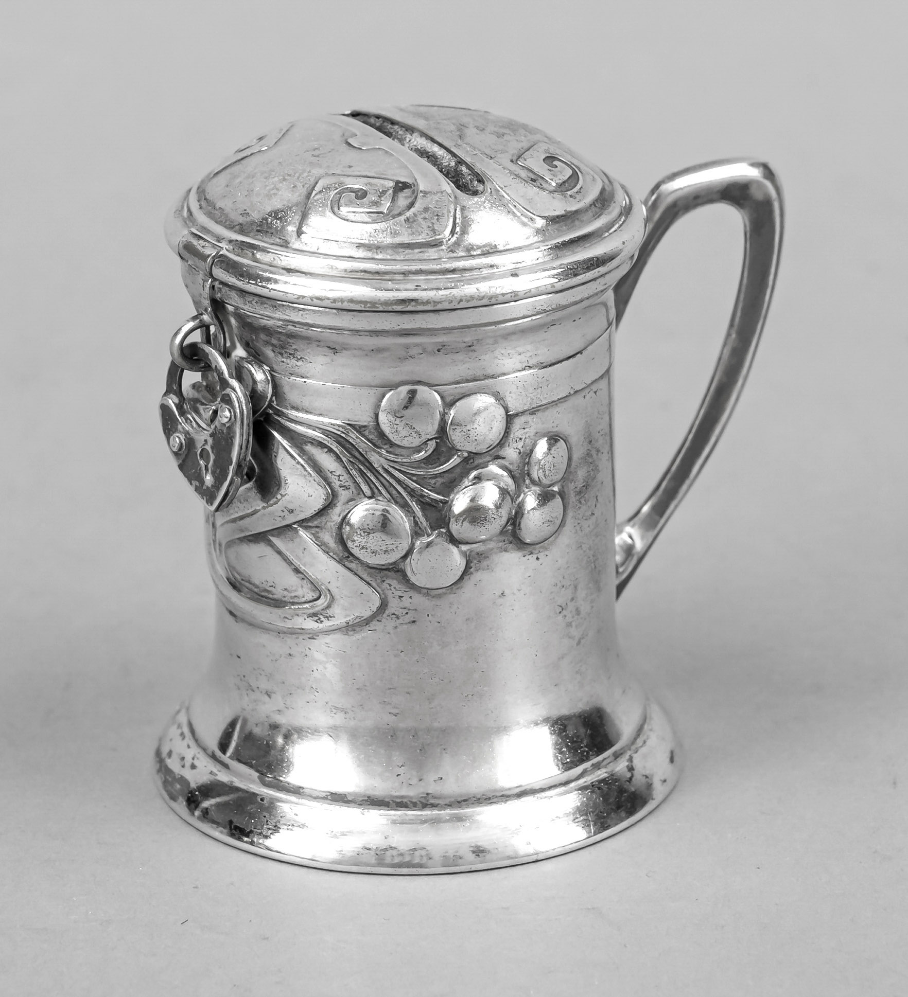 Art Nouveau money box, c. 1900, plated, in the shape of a lidded hump, wall with relief