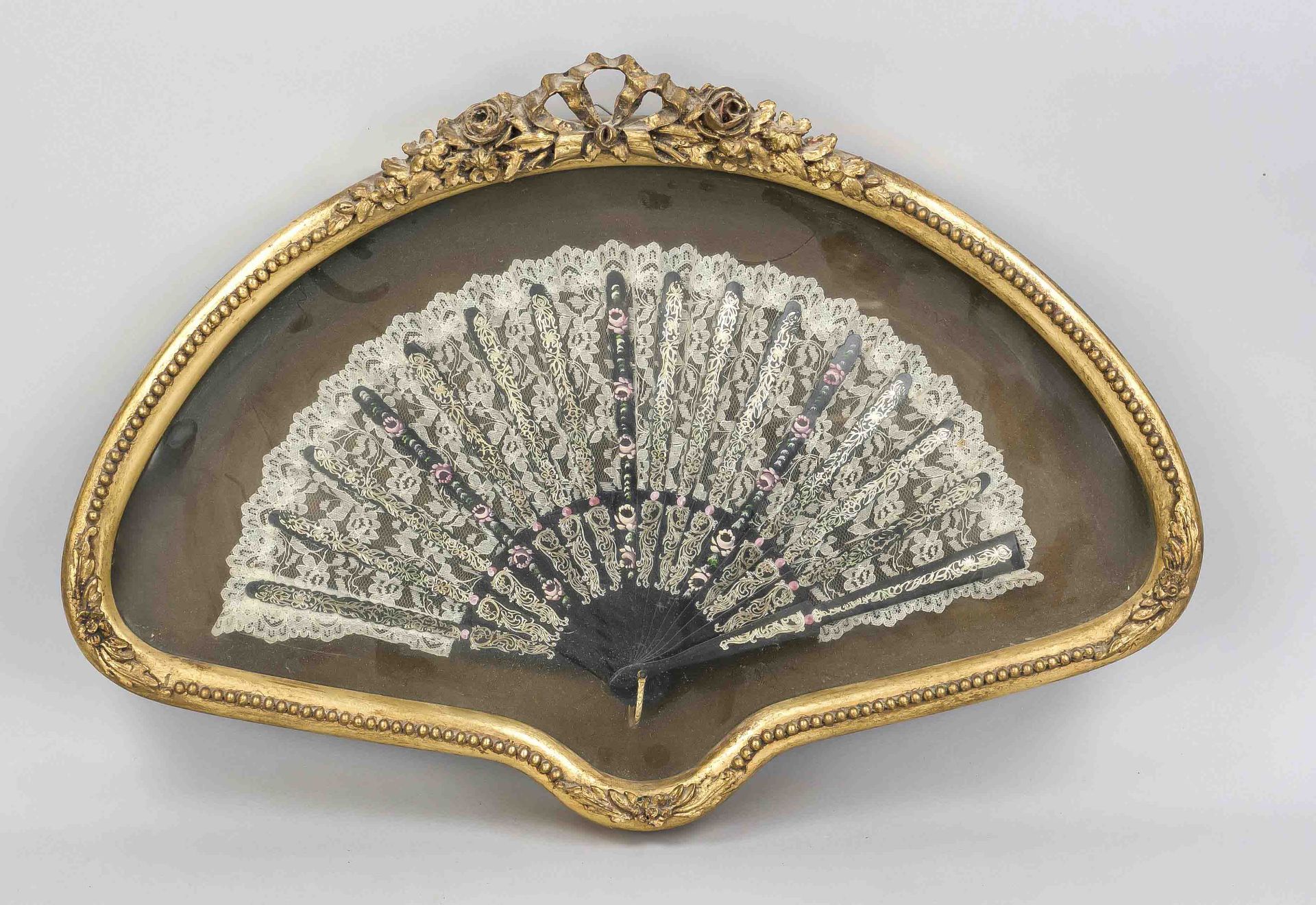 Fan framed behind glass, 20th century, wood and textile, fan struts with flower painting and