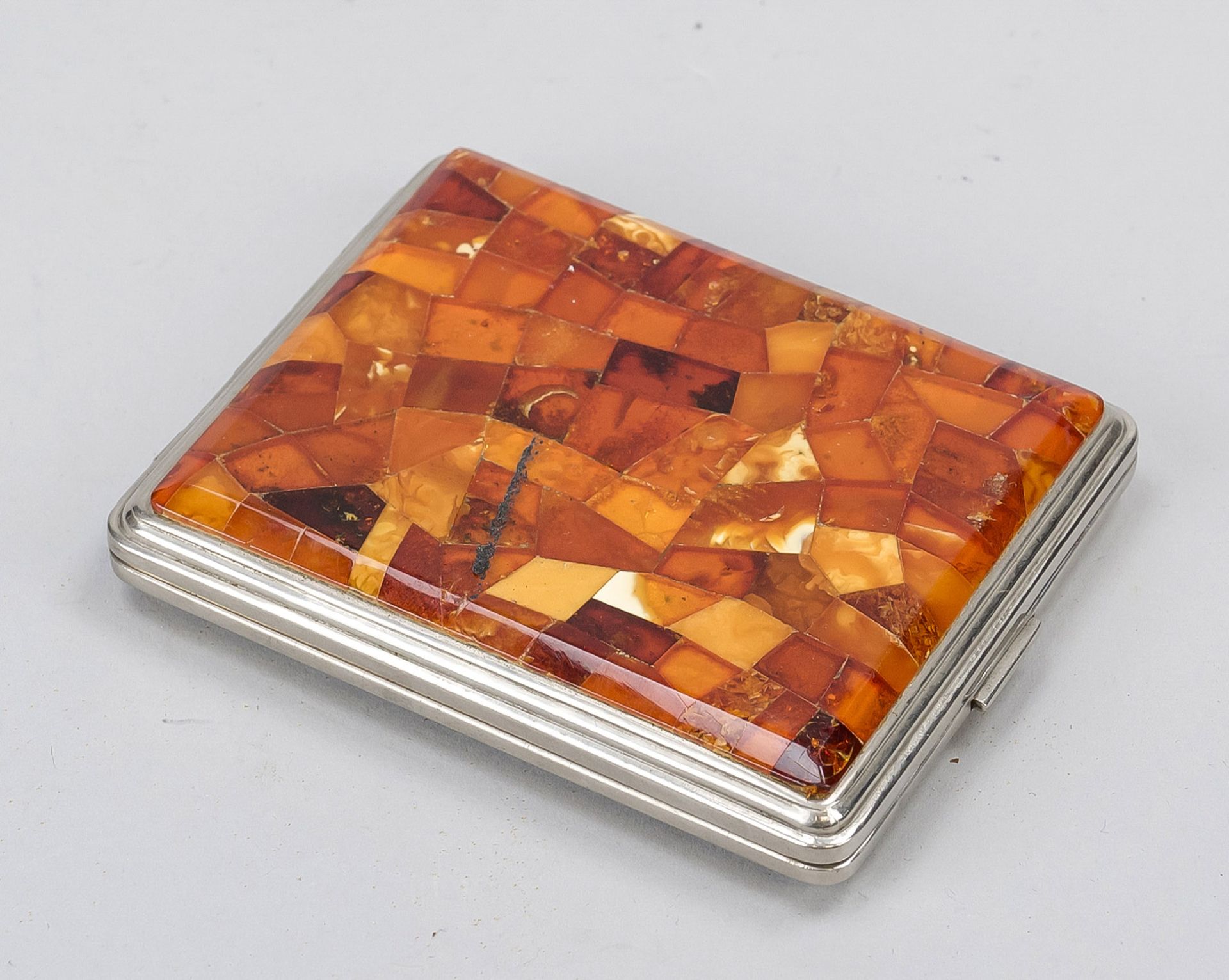 Rectangular cigarette case, 2nd half 20th century, metal, lid with amber inlays, rocaille decoration