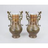 A pair of Art Nouveau vases, circa 1900, ceramic, floral painted, organic brass handles, one glued