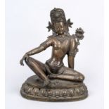 Figure of a saint, Tibet 19th/20th century, bronze. On an openwork lotus base, rubbed & slightly