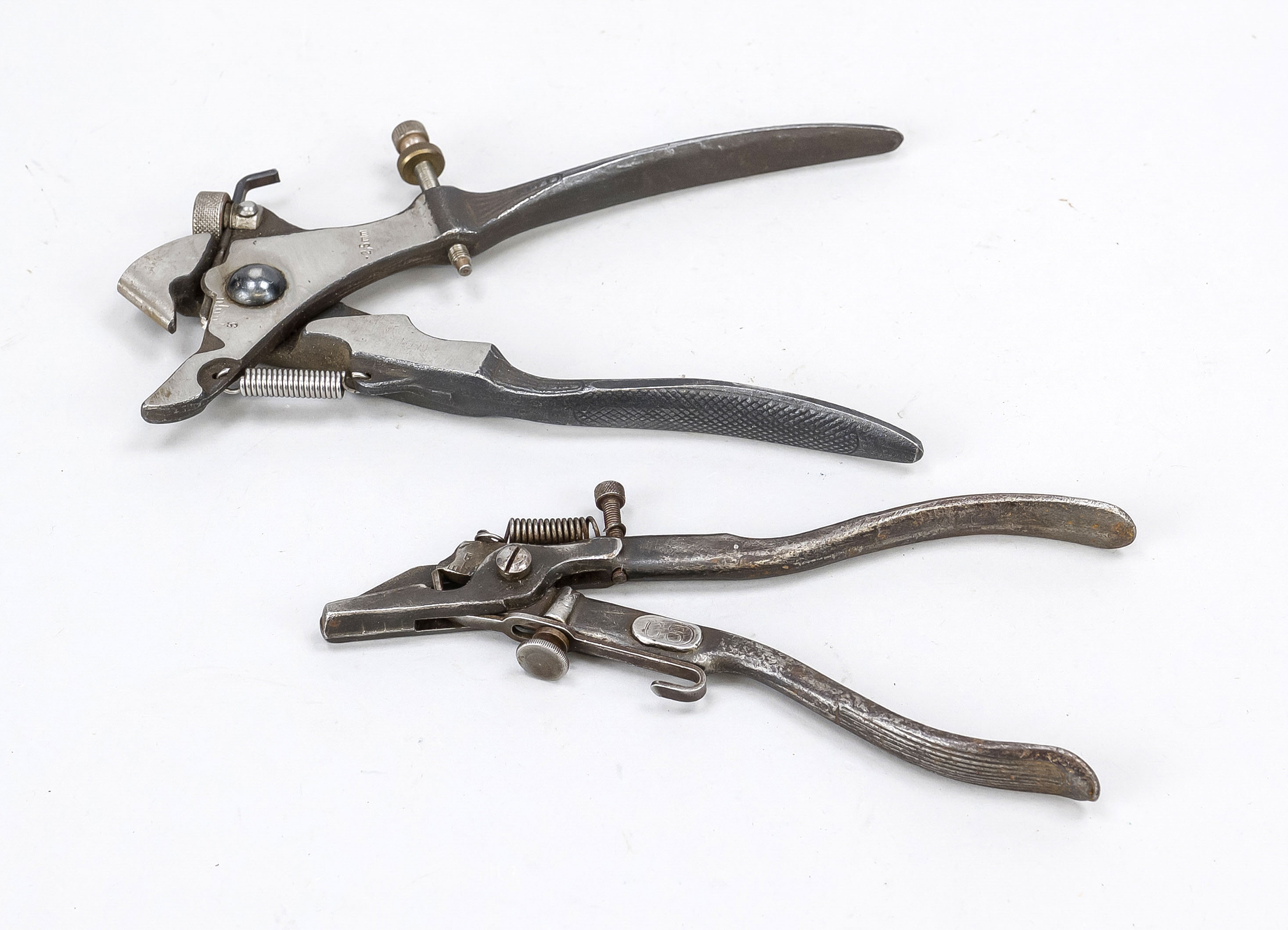 2 historical punch pliers or special pliers, early 20th century, iron. One decorated in relief on