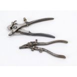 2 historical punch pliers or special pliers, early 20th century, iron. One decorated in relief on