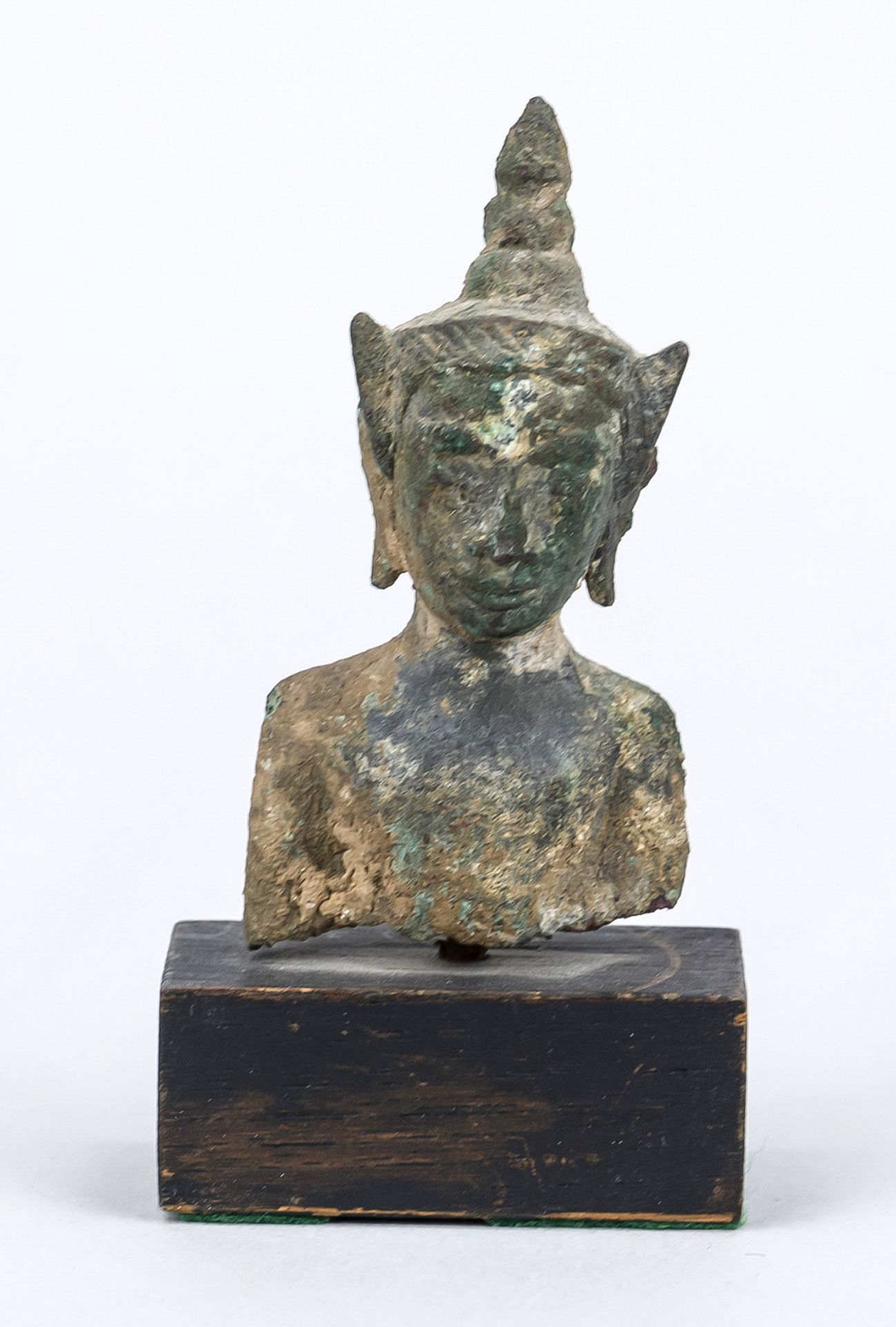 Buddha head/fragment, Southeast Asia, exact age uncertain, bronze. Mounted on a wooden base, h. 10