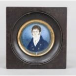 Round miniature, France, c. 1820, polychrome tempera painting on bone panel, young man in dark