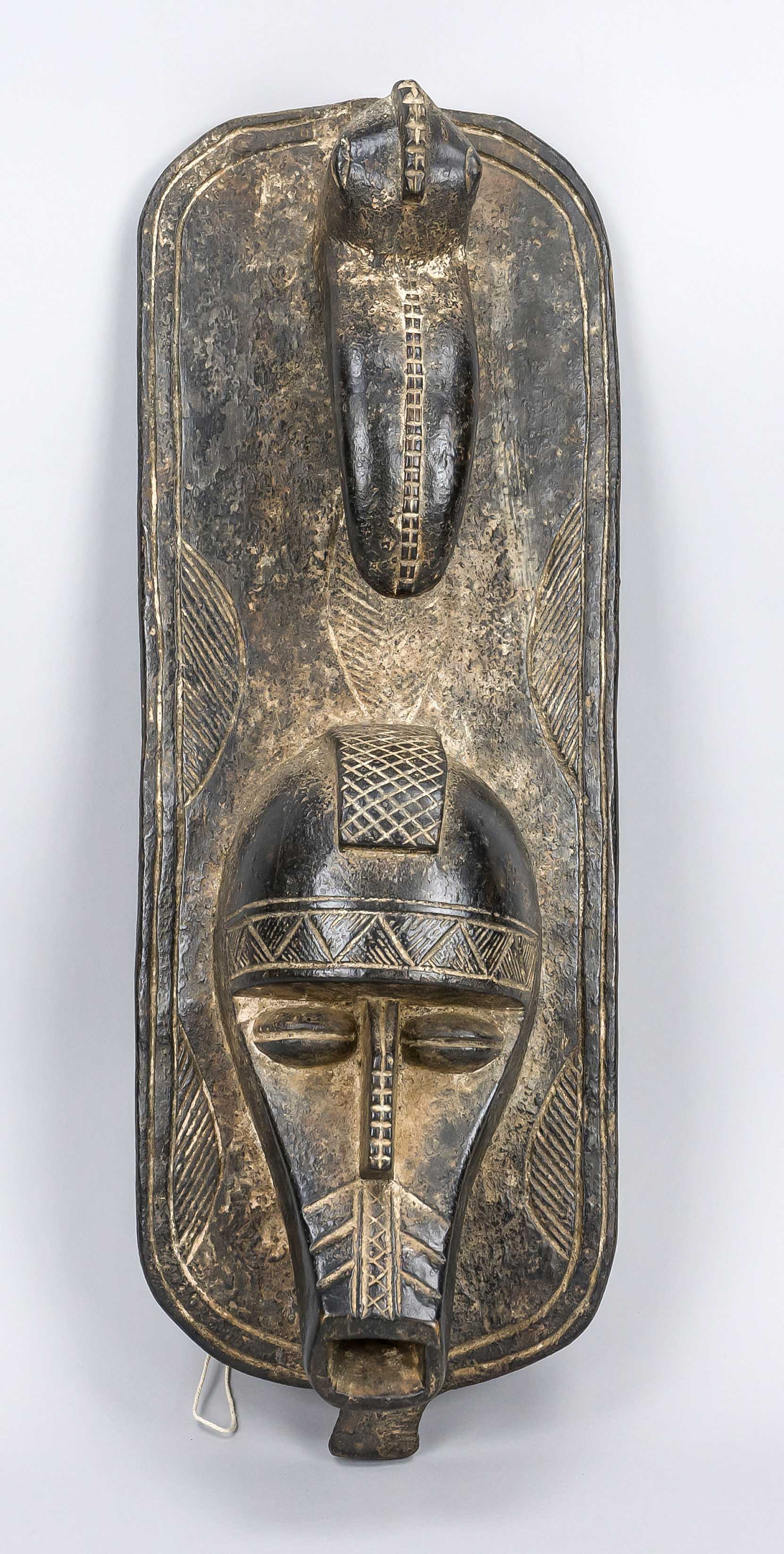 Mask of the Senufo, Ivory Coast, 20th century, dark, light wood, slightly rubbed, 52 x 20 cm
