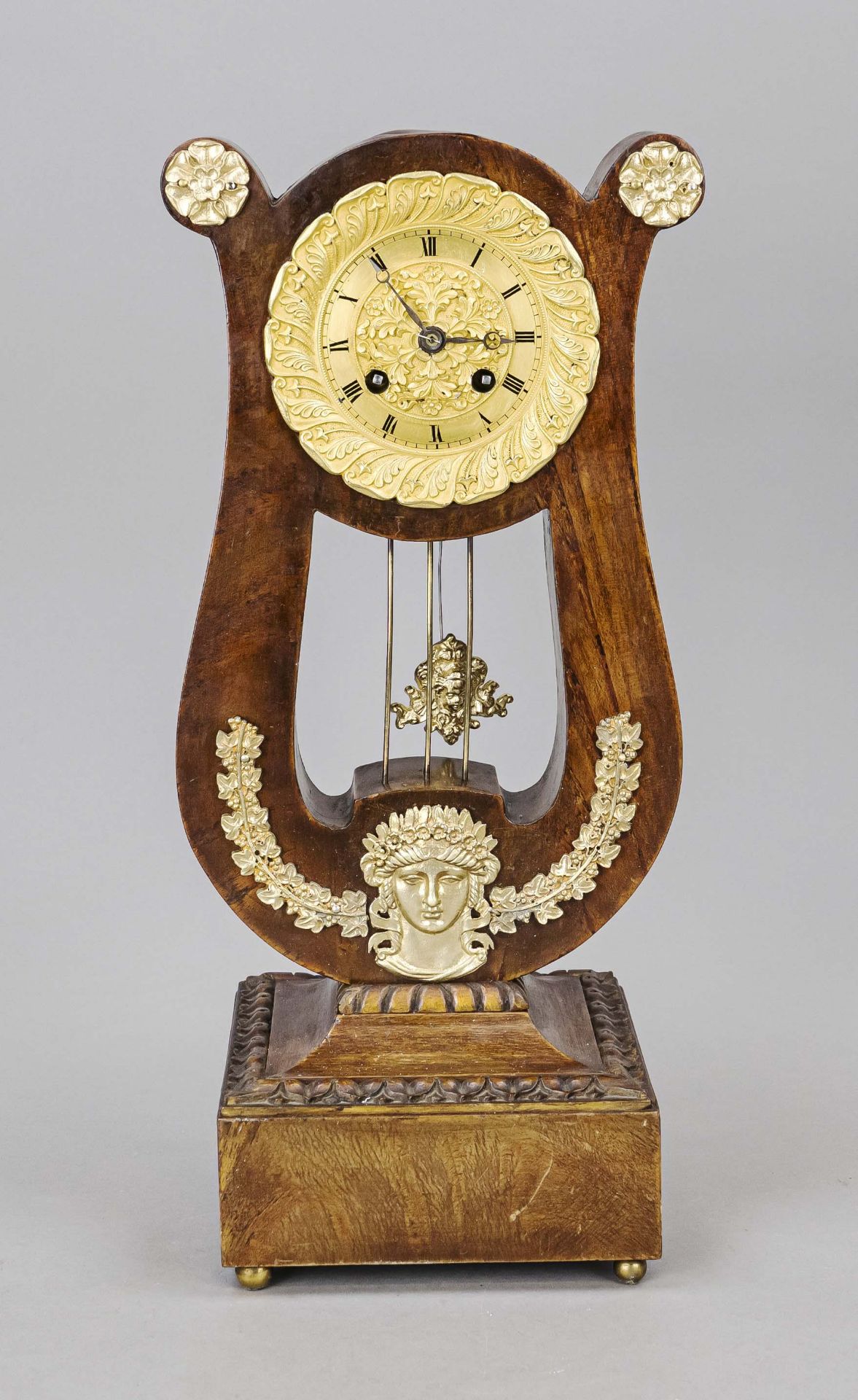 Mahogany pendulum in lyre form, 1st half 19th century, with gilt bronze applications, gilt chapter