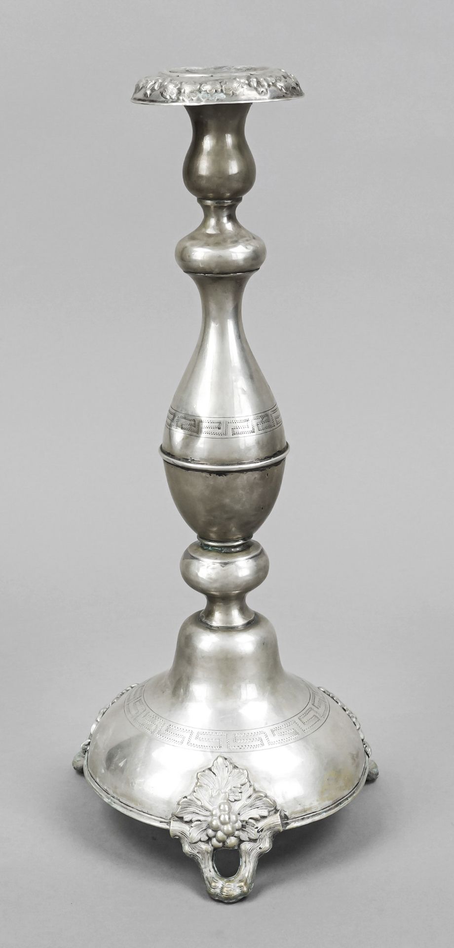 Candlestick, late 19th century, probably under-alloyed silver, round domed stand, on 3 decorated