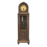 Grandfather clock, circa 1910, German, dark oak, round arch with domed glass, with carved beading
