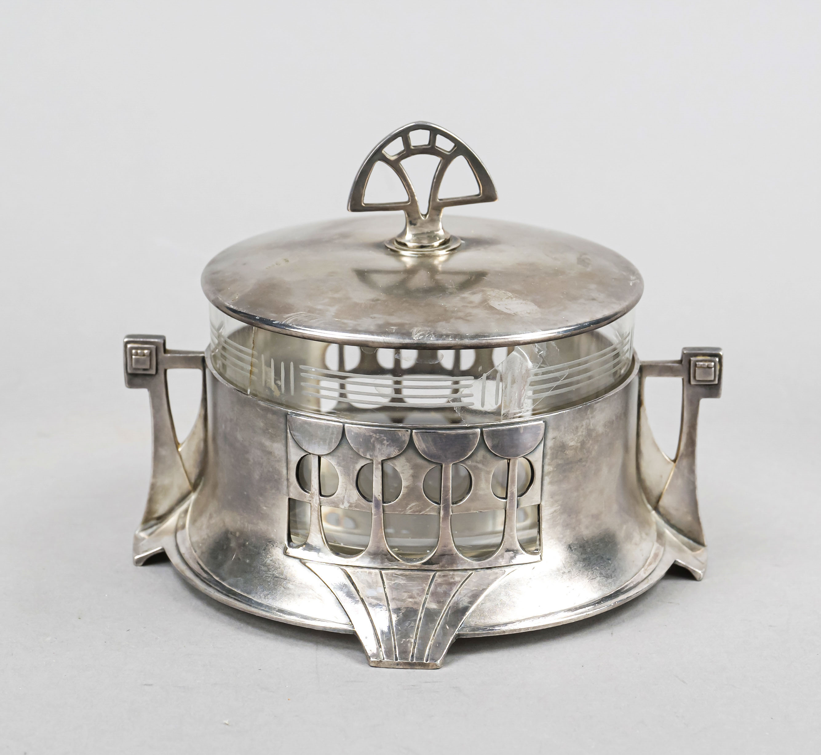 A round Art Nouveau lidded jar, German, early 20th century, maker's mark WMF, Geislingen, ostrich