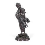 Buddhist ascetic, Japan?, bronze. Wearing a flowing robe, standing on a profiled and ornamented base