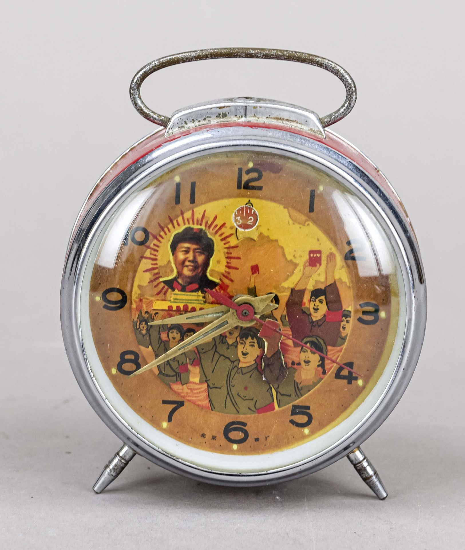 rare alarm clock from China, around 1975, red case partly chrome-plated with bracket, dial with