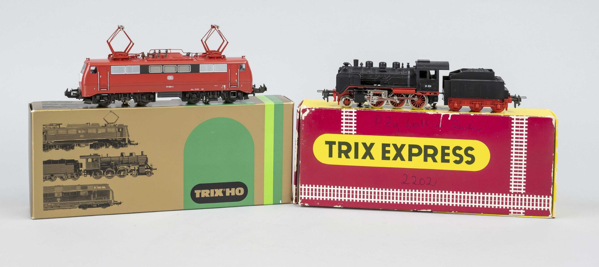 TRIX H0 PZg locomotive with tender 2202 & DB locomotive 111 Both in original packaging measuring 4.5
