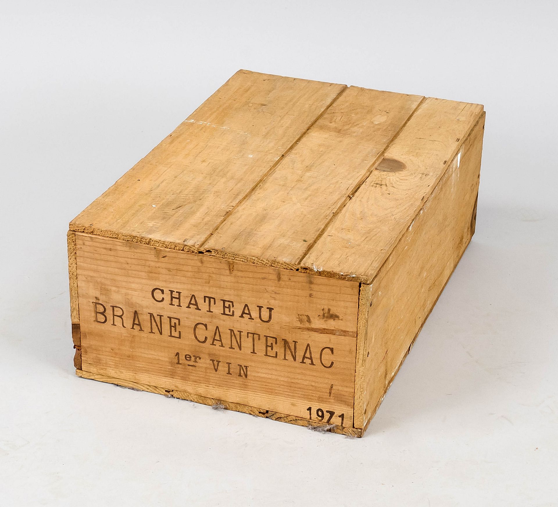 12 bottles of red wine in original transport crate, unopened. Inscribed on the crate ''Chateau Brane