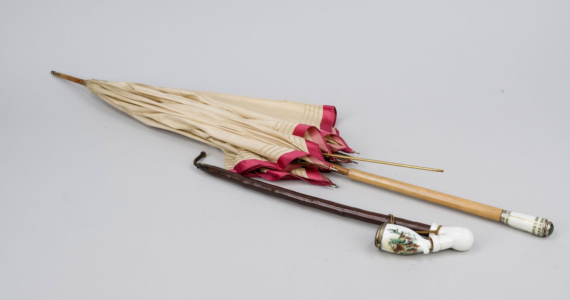 Two pieces, circa 1900: parasol, beech shaft, sheet brass, handle end and tip with silver