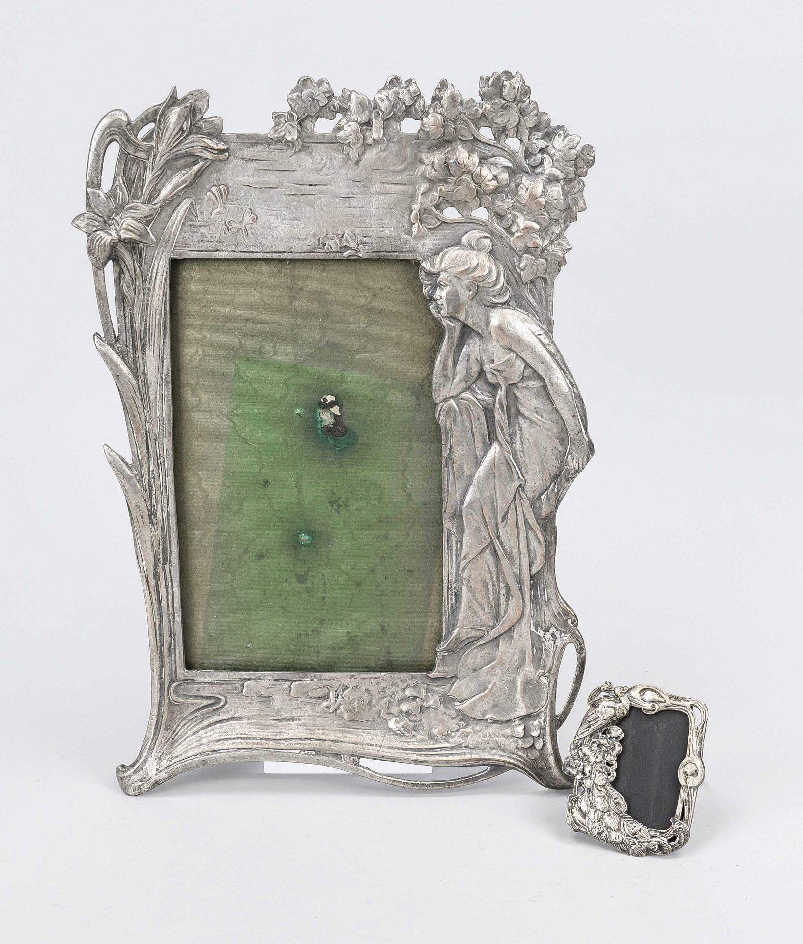 2 Art Nouveau picture frames, early 20th century, white metal. The larger frame with a seated lady