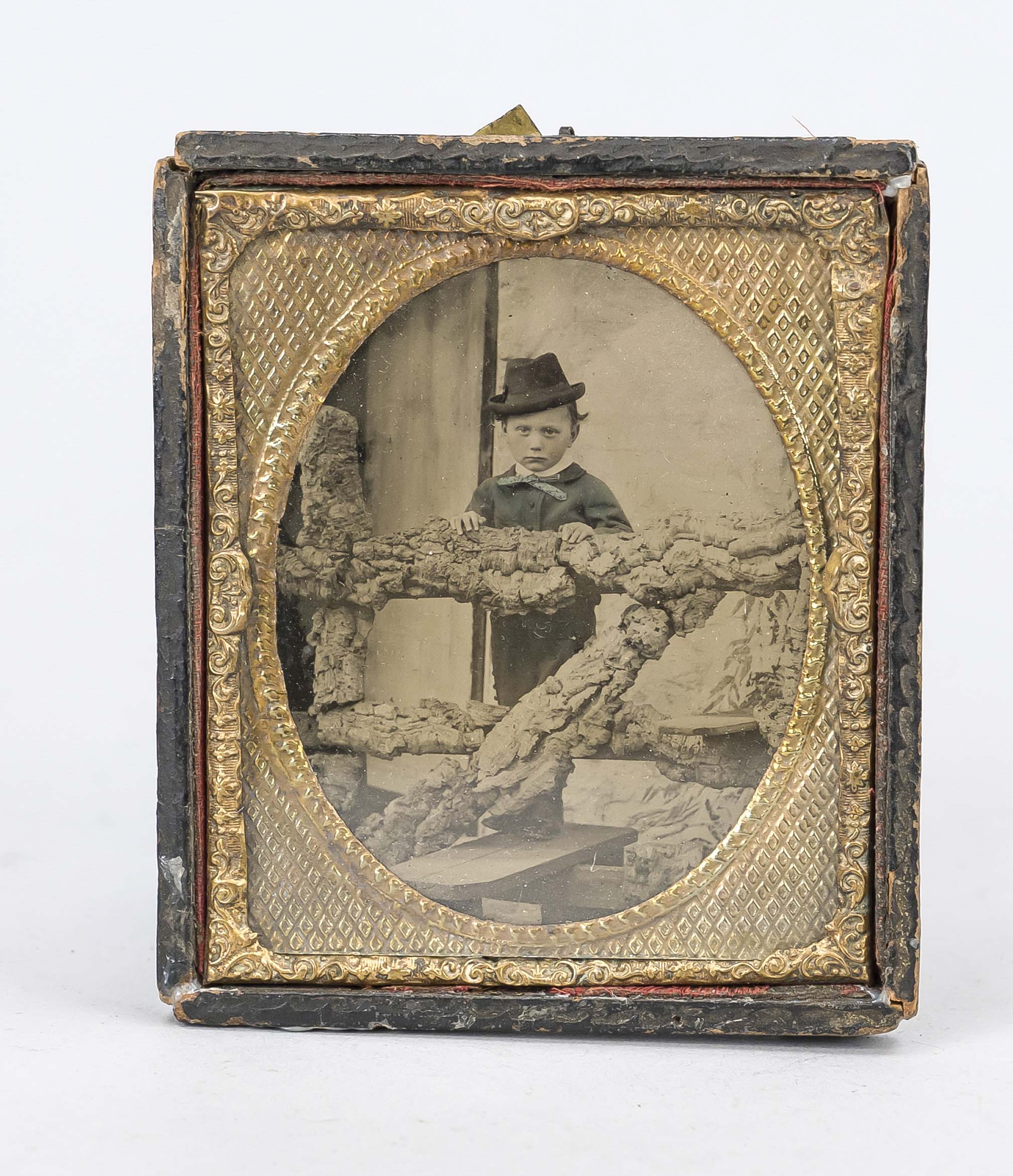 Daguerreotype, 2nd half 19th century Portrait of a boy with hat in front of a wooden gate (?),