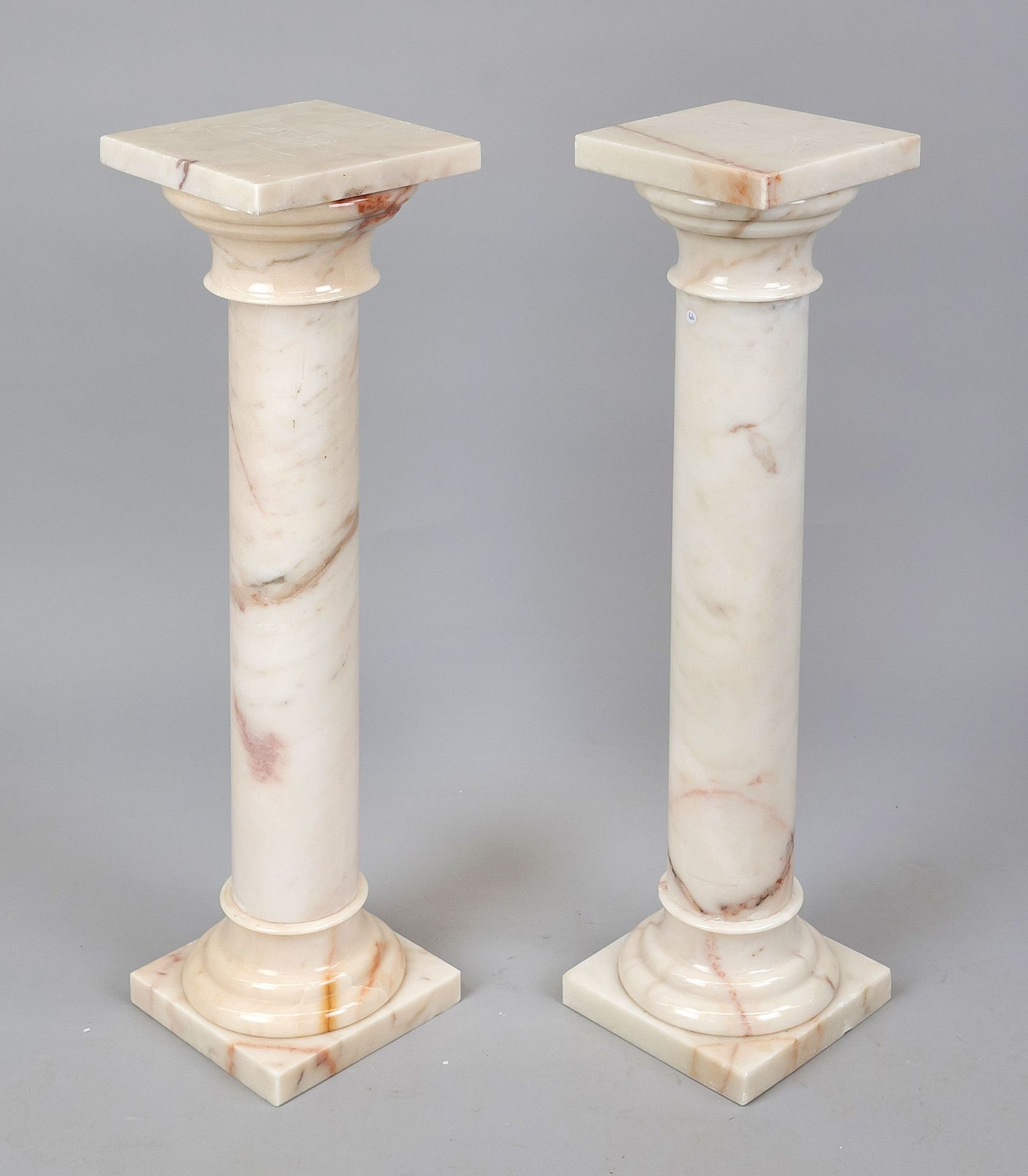 Pair of flower columns, 20th century, light-colored polished stone with natural pattern, smooth