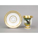 Cup with saucer, Meissen, 18th century, bell-shaped with volute handle, the front reserve with