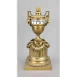 Bronze table clock, circa 1840, vase set on a column with lateral handles in the shape of lion