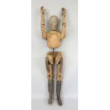 Life-size jointed doll, probably Germany around 1900, solid, made of various woods and iron cuffs.