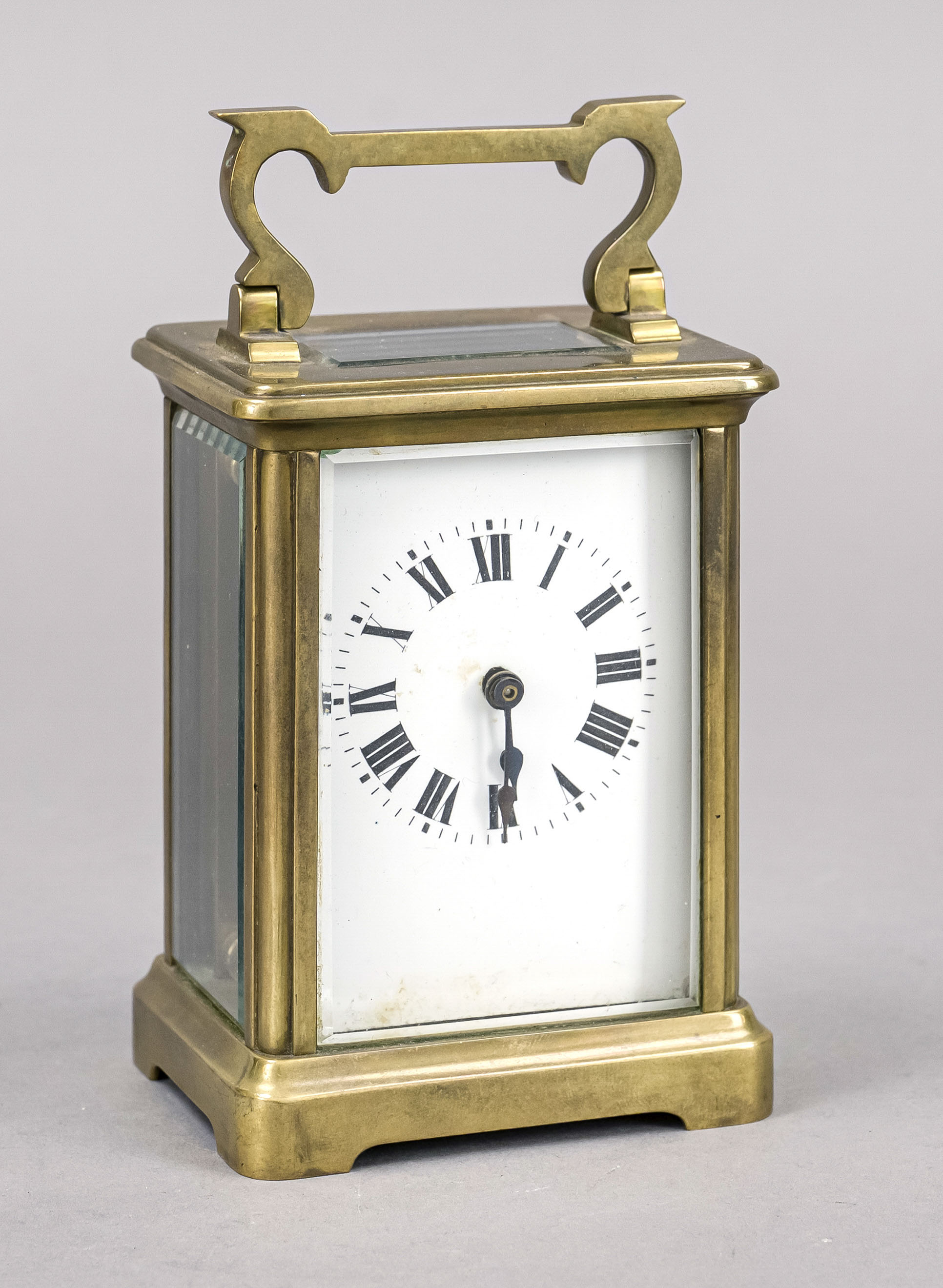 Travel clock France c. 1900, brass, faceted glass right side with chip, top handle, view of the