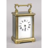 Travel clock France c. 1900, brass, faceted glass right side with chip, top handle, view of the