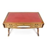 Large English desk, 20th century, yew, hinged top, each with red gold embossed leather top, 5