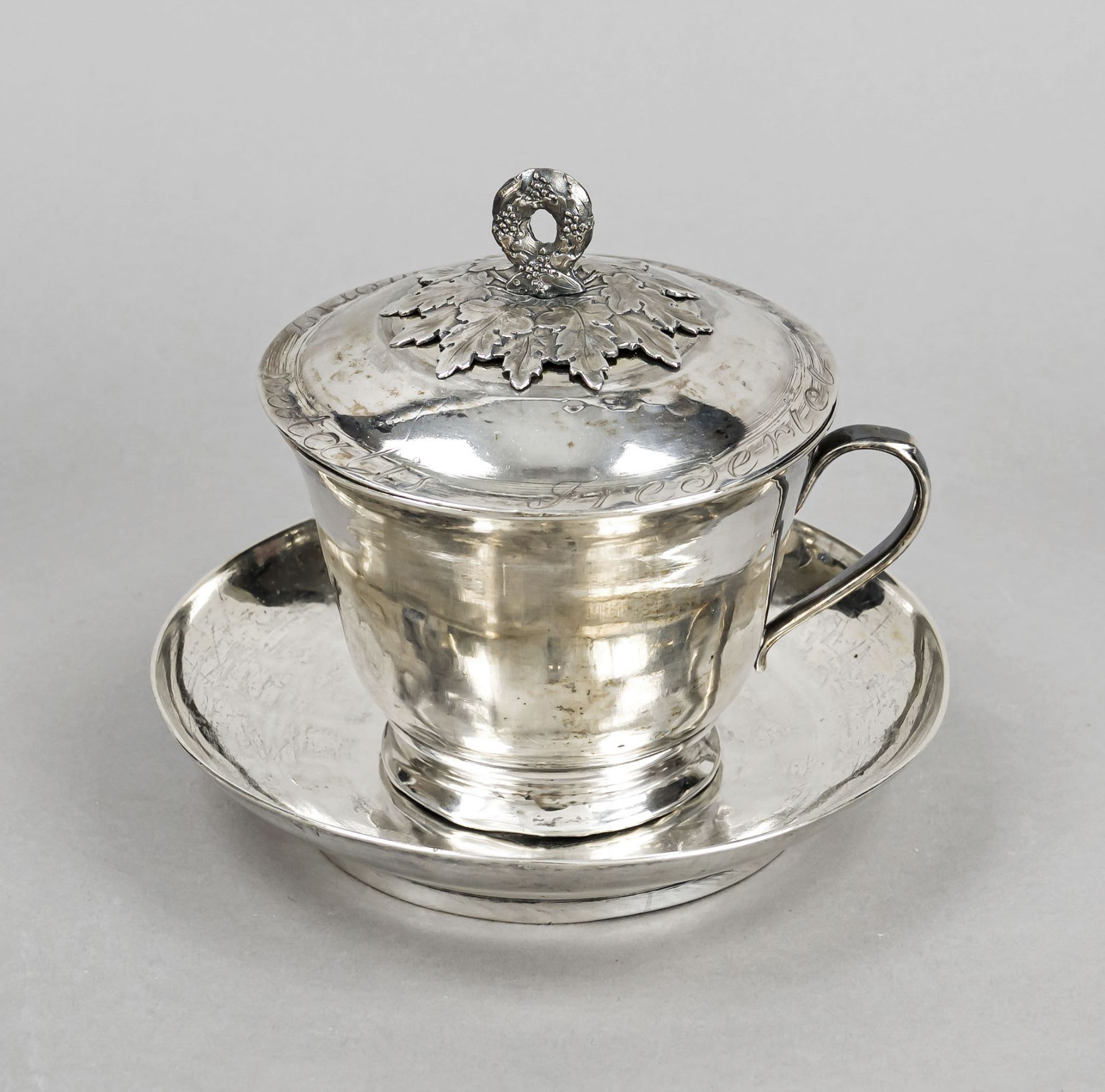 A lidded cup and saucer, hallmarked Russia, 1820, Moscow city mark, MZ, silver 84 zolotniki (875/