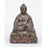Lama on pedestal with saints, Tibet, probably 19th century, bronze. Without base plate, h. 16 cm