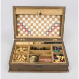 Game collection, c. 1930, hinged lid box, oak body, inside compartmentalized with various game