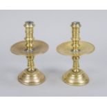 2 candlesticks, 18th century, brass/bronze. Ballustrated shaft, large drip tray in the center,