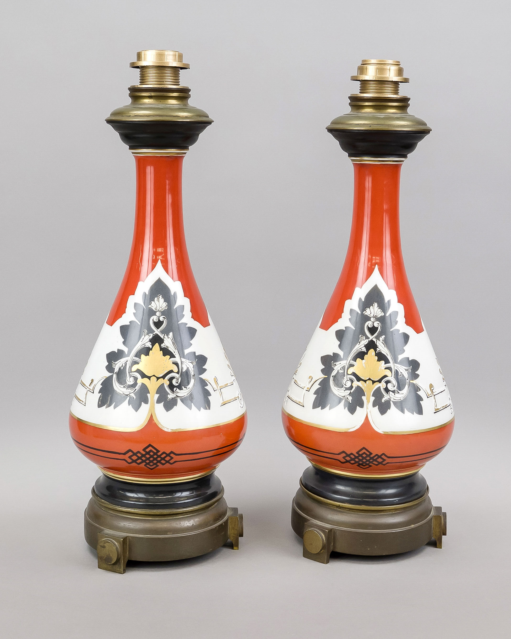 Pair of vase lamps, early 20th century Long-necked vases with various palmettes against an orange