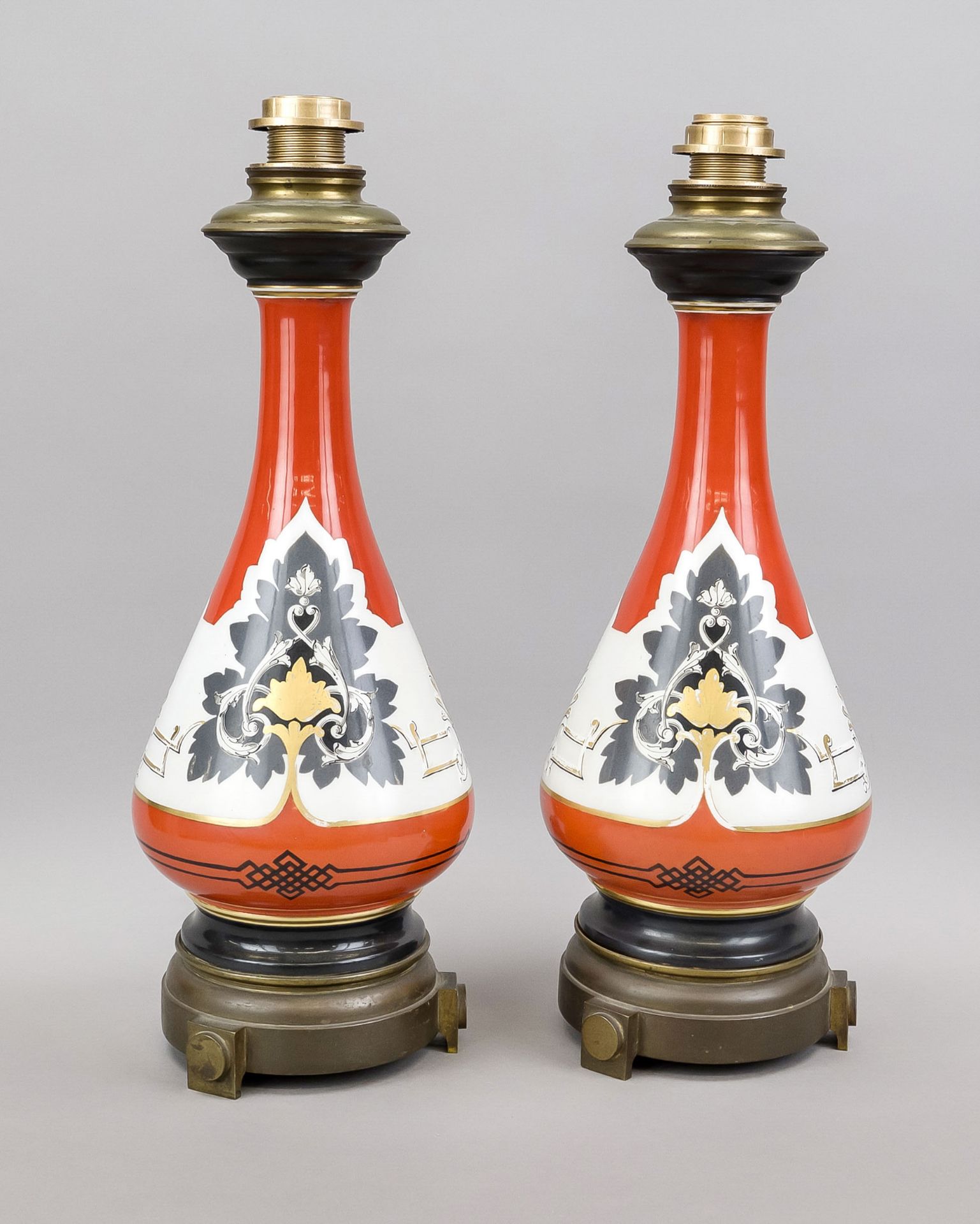 Pair of vase lamps, early 20th century Long-necked vases with various palmettes against an orange