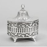 An oval lidded box, 18th century (?), MZ hammered, hallmarked silver, tremolier mark, on 4 feet (