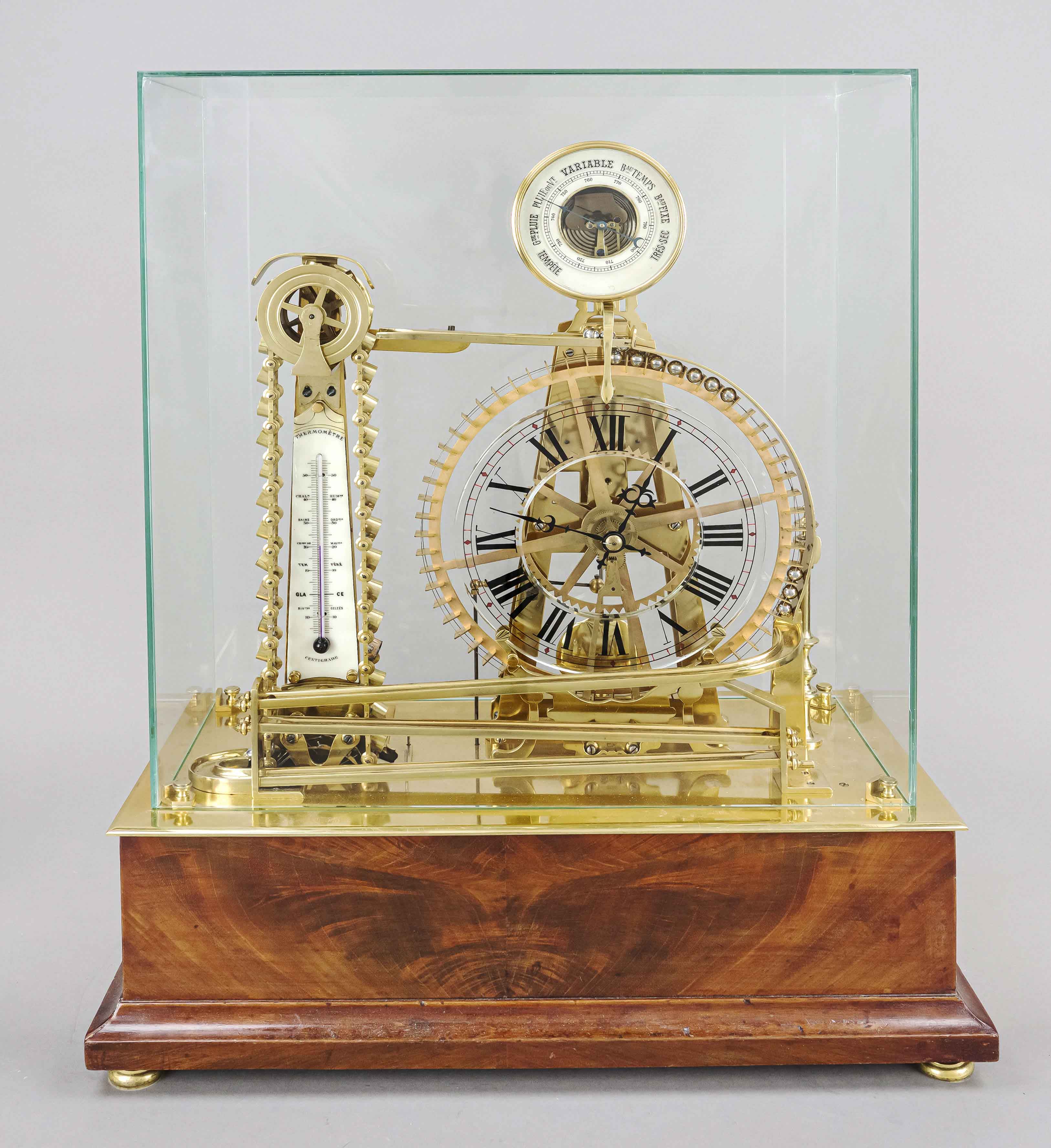 Ball movement clock under a glass lintel on a mahogany wooden base, c. 1840?? unidentified